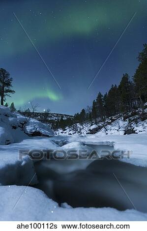 Moonlight and aurora over Tennevik River, Troms, Norway. View Large Photo Image Stock Photograph - Moonlight and aurora over Tennevik River, Troms, Norway.. Fotosearch