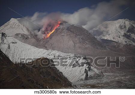Moonlit view of glowing lava down flank of Shiveluch Volcano. View Large Photo Image Stock Photograph - Moonlit view of glowing lava down flank of Shiveluch Volcano.. Fotosearch