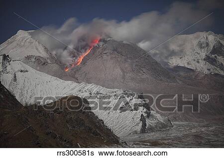 Moonlit view of glowing lava down flank of Shiveluch Volcano. View Large Photo Image Stock Photograph - Moonlit view of glowing lava down flank of Shiveluch Volcano.. Fotosearch