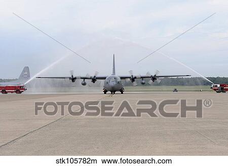 n Air Force C-130E Hercules goes through a fire arch. View Large Photo Image Picture - n Air Force C-130E Hercules goes through a fire arch.. Fotosearch
