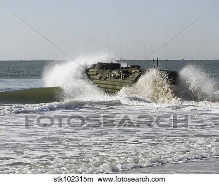 n amphibious assault vehicle splashes through the water. View Large Photo Image Picture - n amphibious assault vehicle splashes through the water.. Fotosearch