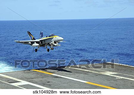 n F/A-18C Hornet lands aboard the aircraft carrier USS Ronald Reagan. View Large Photo Image Picture - n F/A-18C Hornet lands aboard the aircraft carrier USS Ronald Reagan.. Fotosearch