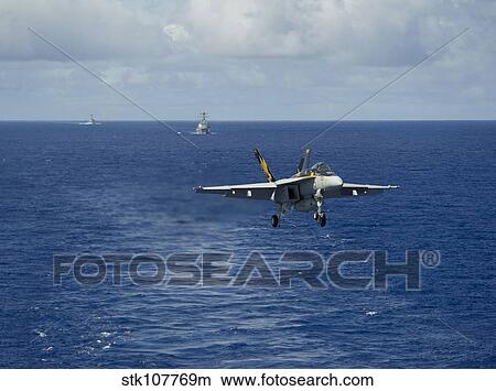 n F/A-18E Super Hornet prepares to make an arrested landing. View Large Photo Image Picture - n F/A-18E Super Hornet prepares to make an arrested landing.. Fotosearch