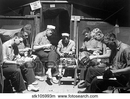 Picture - Navy men shining their shoes.. Fotosearch