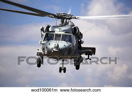 Navy pilots in a SH-60F Seahawk conduct final approach for landing. View Large Photo Image Picture - Navy pilots in a SH-60F Seahawk conduct final approach for landing.. Fotosearch