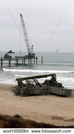 Navy Seabees dismantling an Elevated Causeway Modular. View Large Photo Image Picture - Navy Seabees dismantling an Elevated Causeway Modular.. Fotosearch