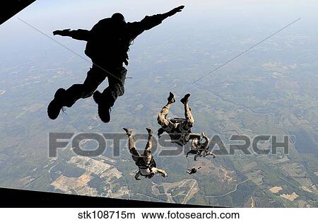 Navy SEALs jump from the ramp of a C-17 Globemaster III over Virginia. View Large Photo Image Picture - Navy SEALs jump from the ramp of a C-17 Globemaster III over Virginia.. Fotosearch