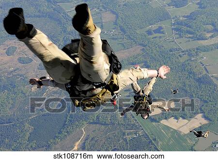 Navy SEALs jump from the ramp of a C-17 Globemaster III over Virginia. View Large Photo Image Picture - Navy SEALs jump from the ramp of a C-17 Globemaster III over Virginia.. Fotosearch