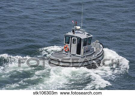Navy working boat moves back to its mooring. View Large Photo Image Picture - Navy working boat moves back to its mooring.. Fotosearch