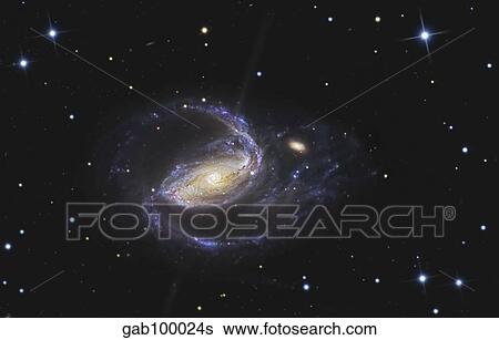Stock Photograph - NGC 1097 is a barred spiral galaxy in the constellation Fornax.. Fotosearch