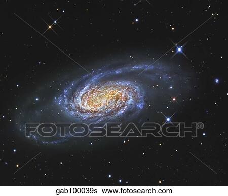 Stock Photograph - NGC 2903 is a barred spiral galaxy in the constellation of Leo.. Fotosearch