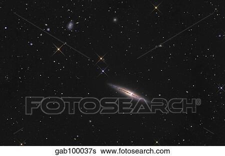 Stock Photograph - NGC 4013 is an edge-on unbarred spiral galaxy in the constellation Ursa Major.. Fotosearch