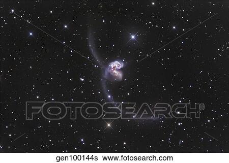 NGC 4038-4039, Interacting Galaxies in Corvus. View Large Photo Image Stock Photograph - NGC 4038-4039, Interacting Galaxies in Corvus.. Fotosearch