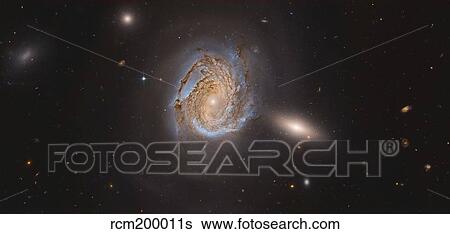 NGC 4911, a spiral galaxy located within the Coma Cluster of galaxies. View Large Photo Image Stock Photograph - NGC 4911, a spiral galaxy located within the Coma Cluster of galaxies.. Fotosearch