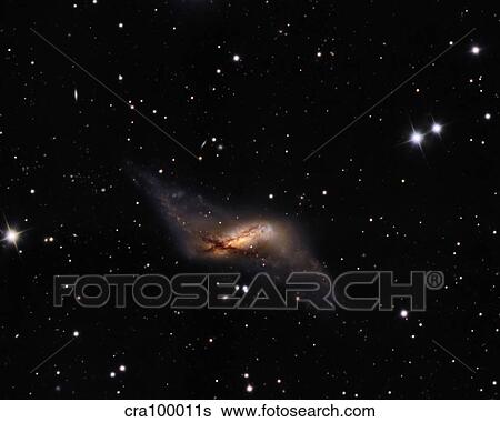 Stock Photograph - NGC660 Distorted Polar ring galaxy. Fotosearch