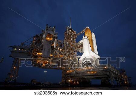 Night view of space shuttle Atlantis on the launch pad at Kennedy Space Center, Florida. View Large Photo Image Stock Photograph - Night view of space shuttle Atlantis on the launch pad at Kennedy Space Center, Florida.. Fotosearch