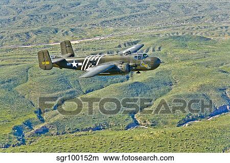 North American B-25G Mitchell bomber in flight near Mesa, Arizona. View Large Photo Image Picture - North American B-25G Mitchell bomber in flight near Mesa, Arizona.. Fotosearch