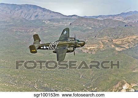 North American B-25G Mitchell bomber in flight near Mesa, Arizona. View Large Photo Image Picture - North American B-25G Mitchell bomber in flight near Mesa, Arizona.. Fotosearch
