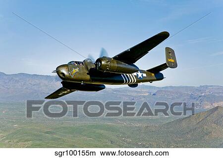 North American B-25G Mitchell bomber in flight near Mesa, Arizona. View Large Photo Image Picture - North American B-25G Mitchell bomber in flight near Mesa, Arizona.. Fotosearch