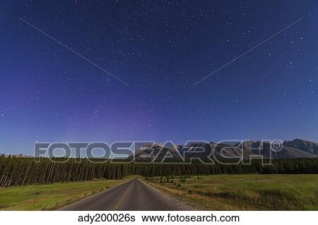 Northern autumn constellations rising over a road in Banff National Park, Canada. View Large Photo Image Stock Photograph - Northern autumn constellations rising over a road in Banff National Park, Canada.. Fotosearch