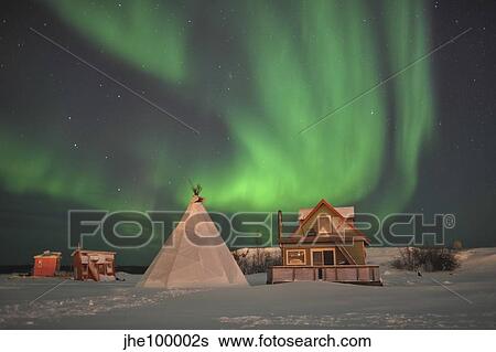 Northern Lights above village, Northwest Territories, Canada. View Large Photo Image Stock Photograph - Northern Lights above village, Northwest Territories, Canada.. Fotosearch