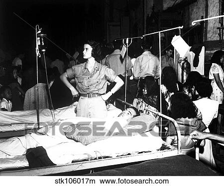 Nurse adjusts glucose injection apparatus for a GI patient. View Large Photo Image Picture - Nurse adjusts glucose injection apparatus for a GI patient.. Fotosearch