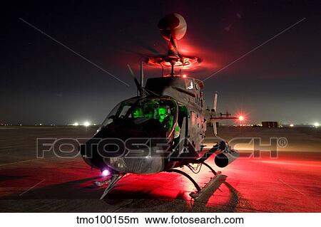 OH-58D Kiowa pilots run through their pre-flight checks before taking off. View Large Photo Image Picture - OH-58D Kiowa pilots run through their pre-flight checks before taking off.. Fotosearch