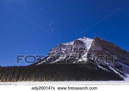Orion star trails above Mount Fairview, Alberta, Canada. View Large Photo Image Stock Photograph - Orion star trails above Mount Fairview, Alberta, Canada.. Fotosearch