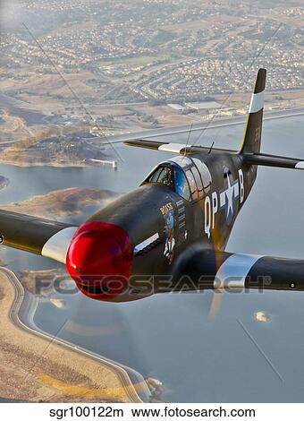 P-51B Mustang in flight over Chino, California. View Large Photo Image Picture - P-51B Mustang in flight over Chino, California.. Fotosearch