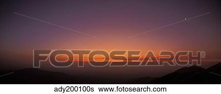 Stock Photograph - Panoramic view of Las Campanas Observatory at twilight, Chile.. Fotosearch