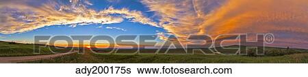 Stock Photograph - Panoramic view of sunset at Reesor Ranch, near Cypress Hills, Alberta, Canda.. Fotosearch
