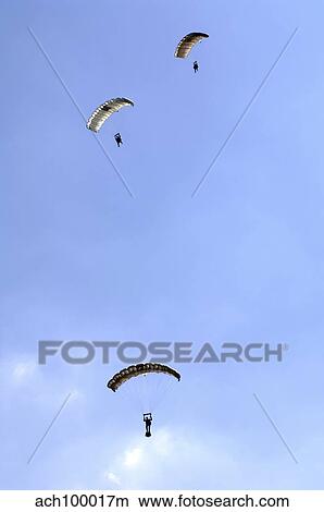 Picture - Paratroopers from the Pathfinder Platoon descend through the sky.. Fotosearch