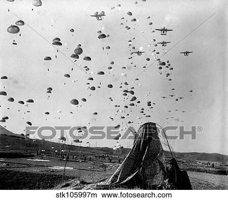 Paratroopers jump from from C-119's over Korea. View Large Photo Image Picture - Paratroopers jump from from C-119's over Korea.. Fotosearch