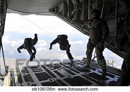 Paratroopers with the Spanish military jump from a C-130J Super Hercules. View Large Photo Image Picture - Paratroopers with the Spanish military jump from a C-130J Super Hercules.. Fotosearch