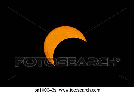 Stock Photograph - Partial solar eclipse of 2012.. Fotosearch