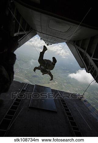 Philippine Army soldier jumps from a CH-53E Super Stallion. View Large Photo Image Picture - Philippine Army soldier jumps from a CH-53E Super Stallion.. Fotosearch