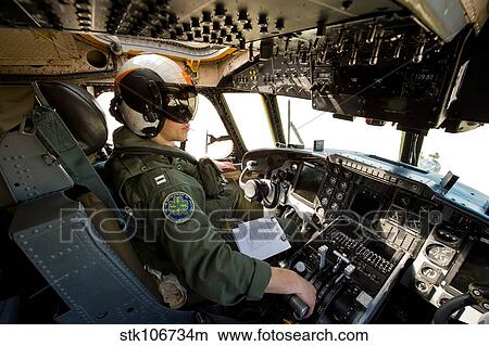 Pilot sits in the pilot seat of a C-2 Greyhound. View Large Photo Image Picture - Pilot sits in the pilot seat of a C-2 Greyhound.. Fotosearch