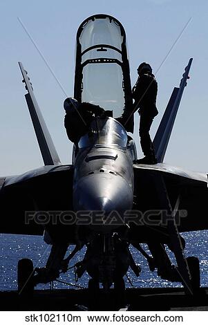 Picture - Pilots conducts a pre-flight inspection on an F/A-18F Super Hornet.. Fotosearch