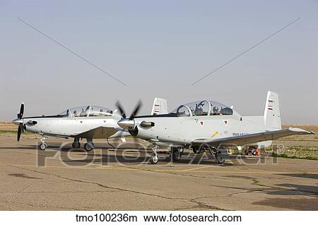 Pilots perform a pre-flight on their T-6 Texan trainer aircraft. View Large Photo Image Picture - Pilots perform a pre-flight on their T-6 Texan trainer aircraft.. Fotosearch