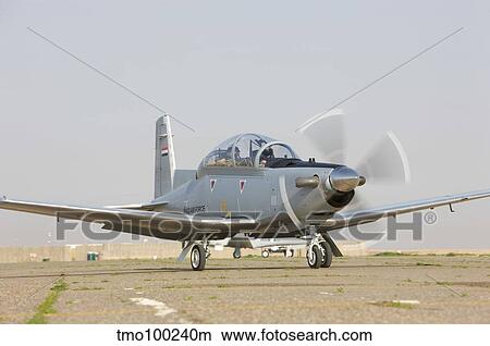 Pilots perform a pre-flight on their T-6 Texan trainer aircraft. View Large Photo Image Picture - Pilots perform a pre-flight on their T-6 Texan trainer aircraft.. Fotosearch