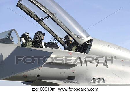 Picture - Pilots perform preflight checks in the cockpit of a Eurofighter Typhoon.. Fotosearch