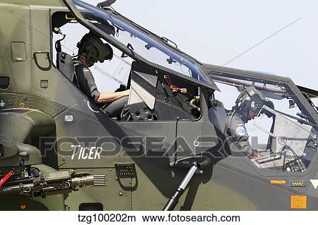 Picture - Pilots prepare for a mission in the Tiger Eurocopter of the Germany Army.. Fotosearch