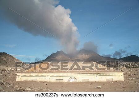 Stock Photograph - Plymouth Courthouse buried in lahar deposits from Soufriere Hills volcano, Montserrat, Caribbean.. Fotosearch