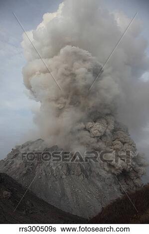 Stock Photograph - Pyroclastic flow descending flank of Rerombola lava dome of Paluweh volcano.. Fotosearch