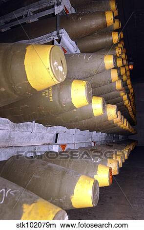 Racks of bombs sit inside the interior of a warehouse. View Large Photo Image Picture - Racks of bombs sit inside the interior of a warehouse.. Fotosearch