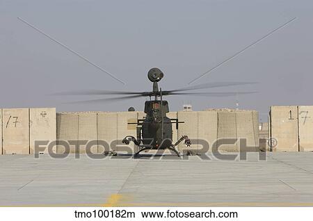 Rear view of a OH-58D Kiowa Warrior at Camp Speicher, Iraq. View Large Photo Image Picture - Rear view of a OH-58D Kiowa Warrior at Camp Speicher, Iraq.. Fotosearch