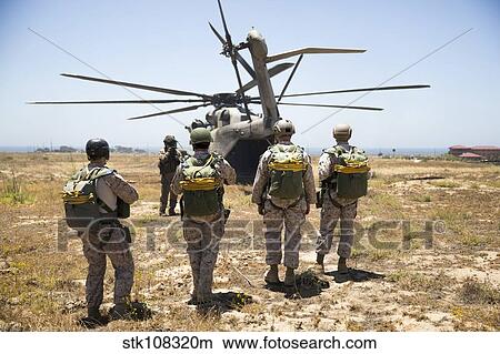 Reconnaissance Marines prepare to board a CH-53E Super Stallion. View Large Photo Image Picture - Reconnaissance Marines prepare to board a CH-53E Super Stallion.. Fotosearch