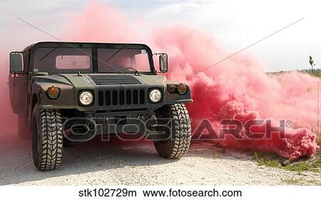 Red smoke billows out onto a humvee. View Large Photo Image Picture - Red smoke billows out onto a humvee.. Fotosearch