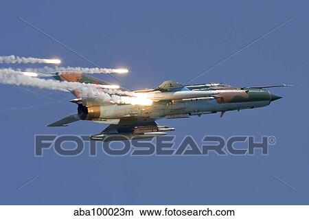 Romanian Air Force MiG-21 MF LanceR popping flares. View Large Photo Image Picture - Romanian Air Force MiG-21 MF LanceR popping flares.. Fotosearch