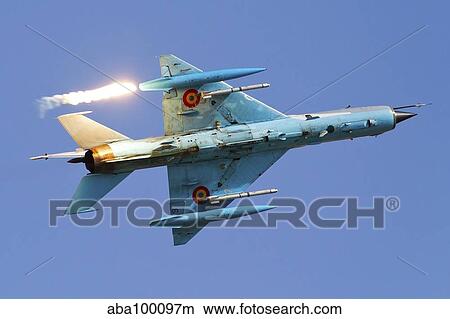 Romanian Air Force MiG-21 MF LanceR popping flares. View Large Photo Image Picture - Romanian Air Force MiG-21 MF LanceR popping flares.. Fotosearch